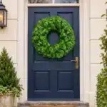 Plain evergreen Christmas wreath 75cm on outside navy door