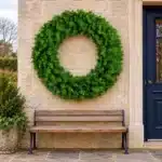 Plain evergreen outdoor Christmas wreath 100cm on outside wall