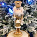 Champagne nutcracker soldier Christmas decoration figurine for table, shelves or mantelpiece