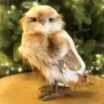 Brown furry owl indoor Christmas decoration with smooth head 27cm tall close up