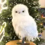 Furry long hair owl with smooth head Christmas decoration close up