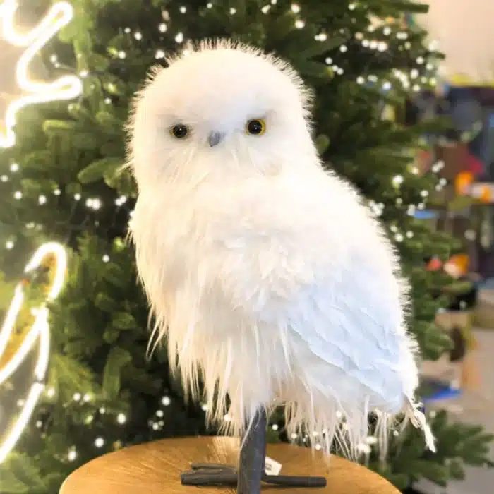 Furry long hair owl with smooth head Christmas decoration close up